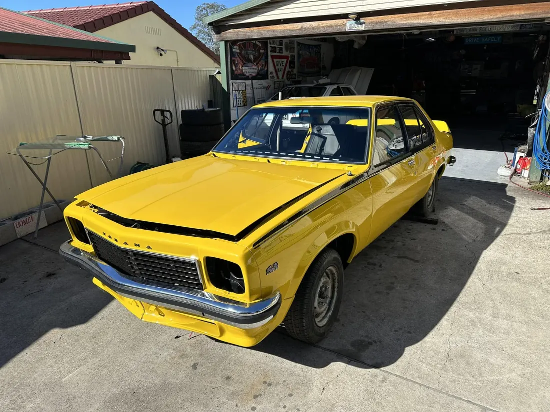 Australian muscle car in a driveway during windscreen replacement