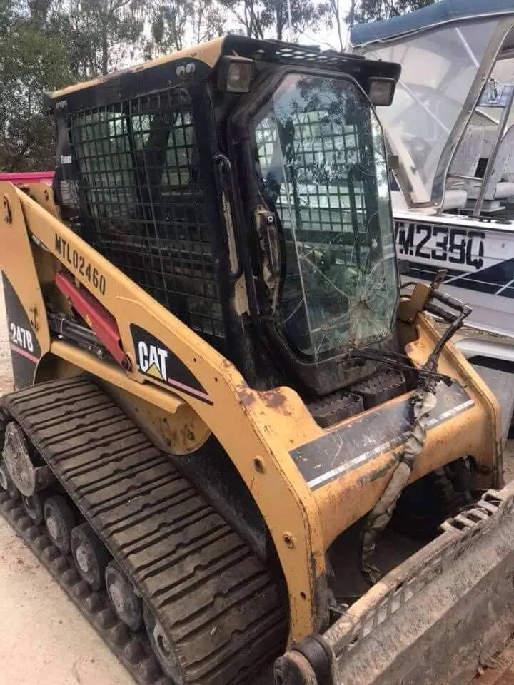 Tracked skid steer loader with cab glass replaced on site