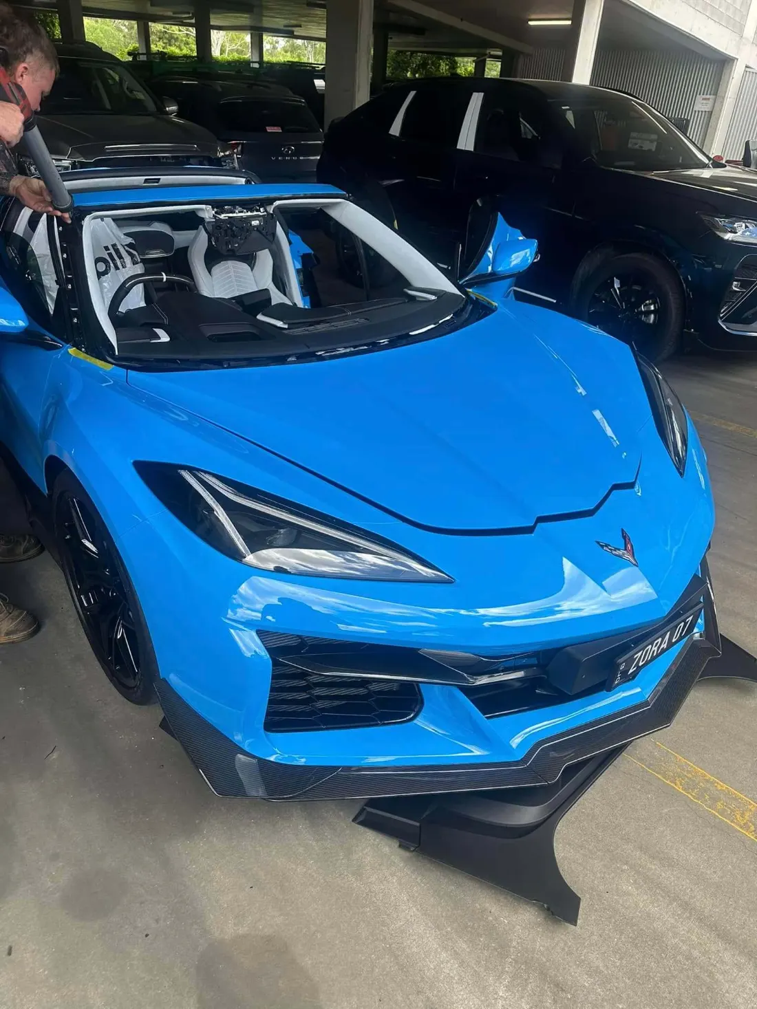 Modern performance car with the windscreen removed in a workshop