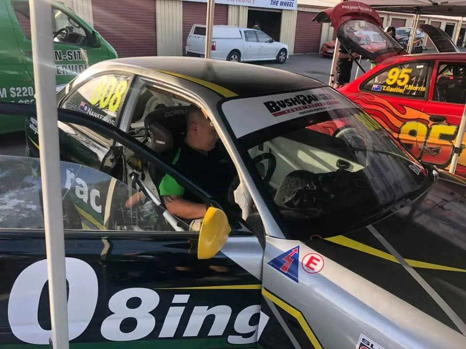 Race car in the pits during windscreen work