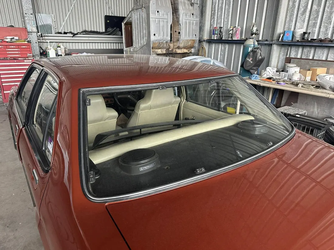 Rear windscreen set into a restored classic sedan