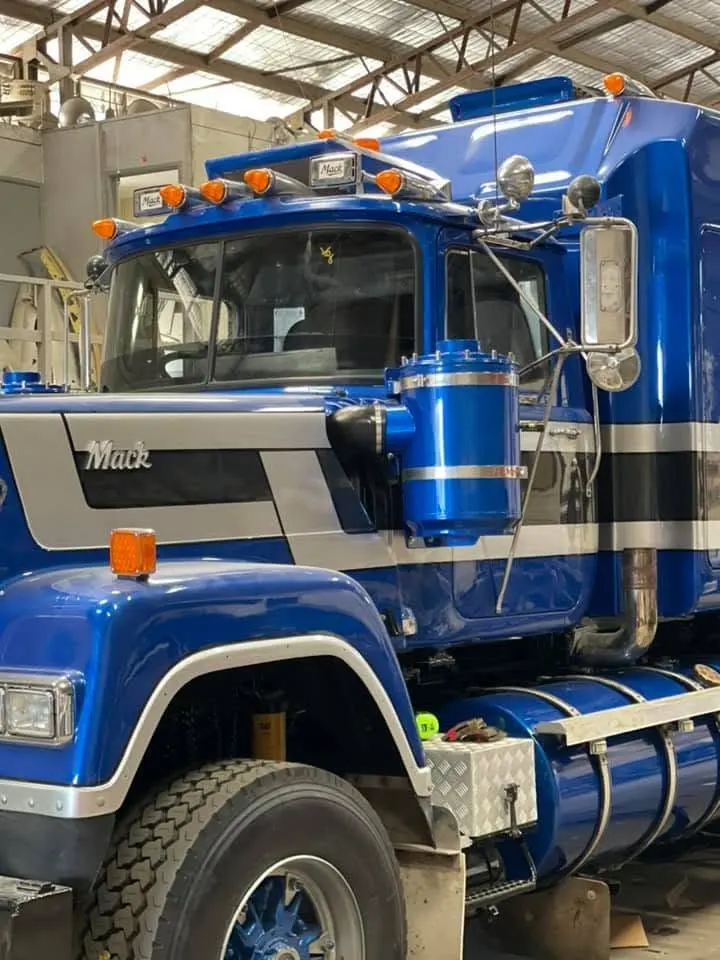 Truck windscreen being replaced at a loading dock at night