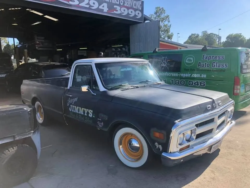 Restored pickup in a workshop after windscreen work